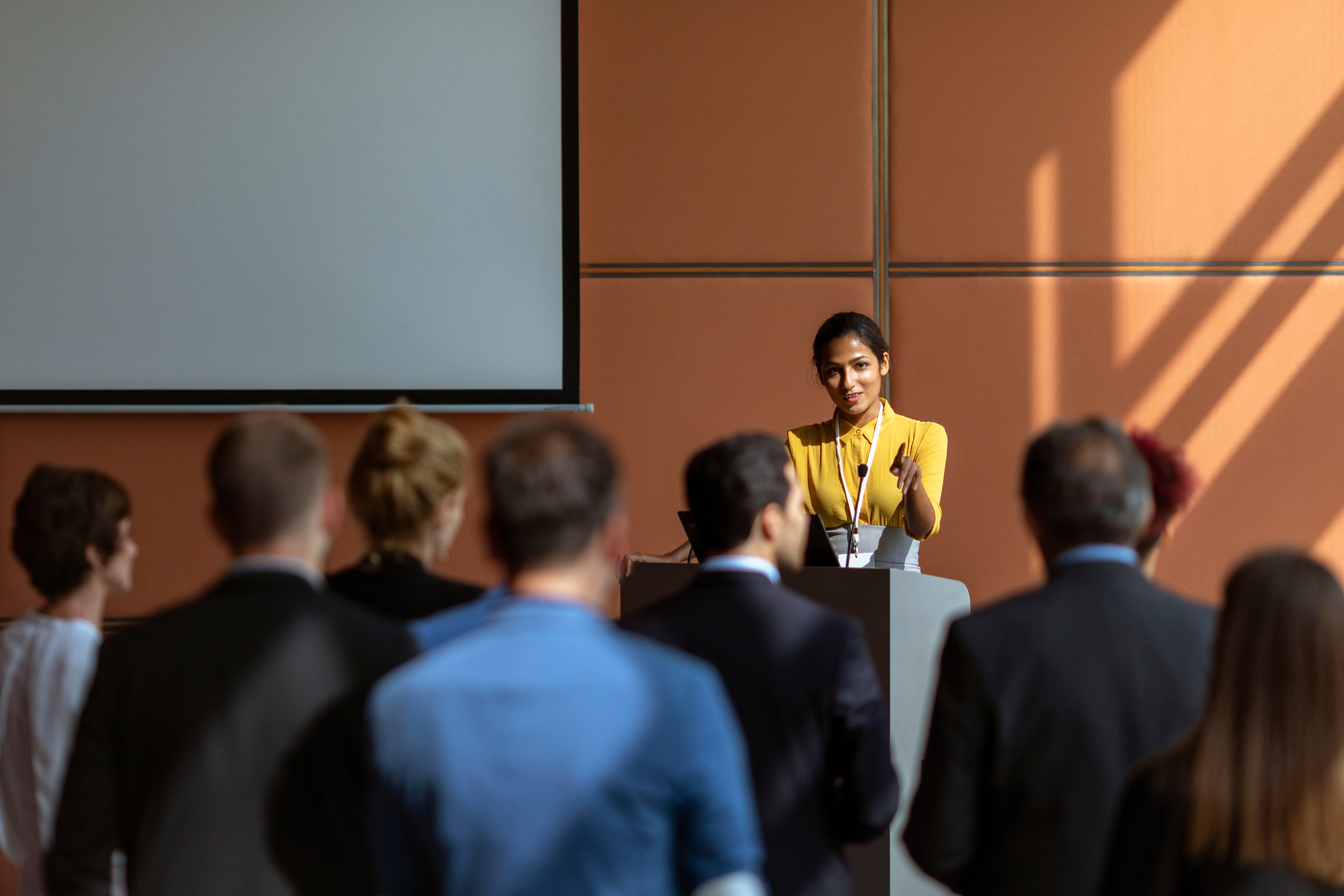 Woman Speaking at a Conference 